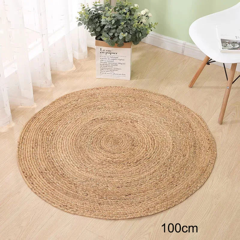 Large 100cm natural straw rug styled with white curtains and potted plant
