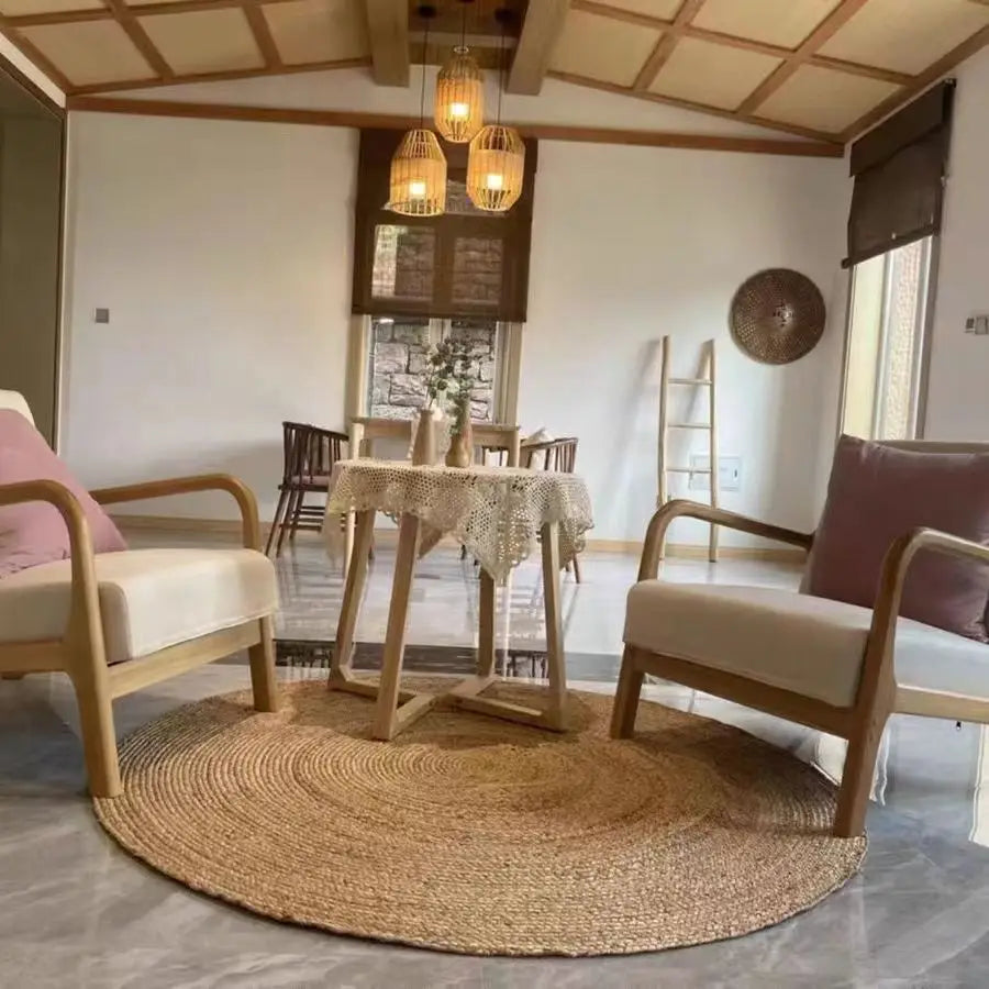 Handcrafted straw rug placed under dining table set in rustic-style interior