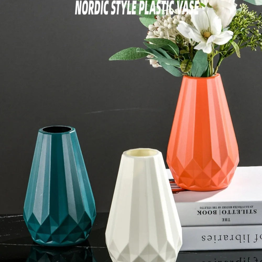 Set of three Nordic diamond flower vases in white, orange, and dark green with modern styling