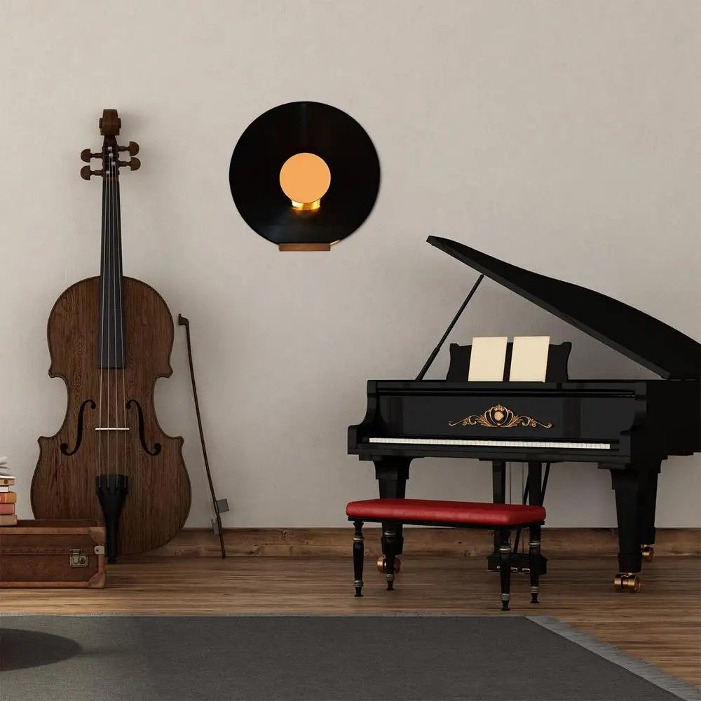 Vinyl record displayed on wooden wall mount above a black piano in a cozy music room – Nestoryplace