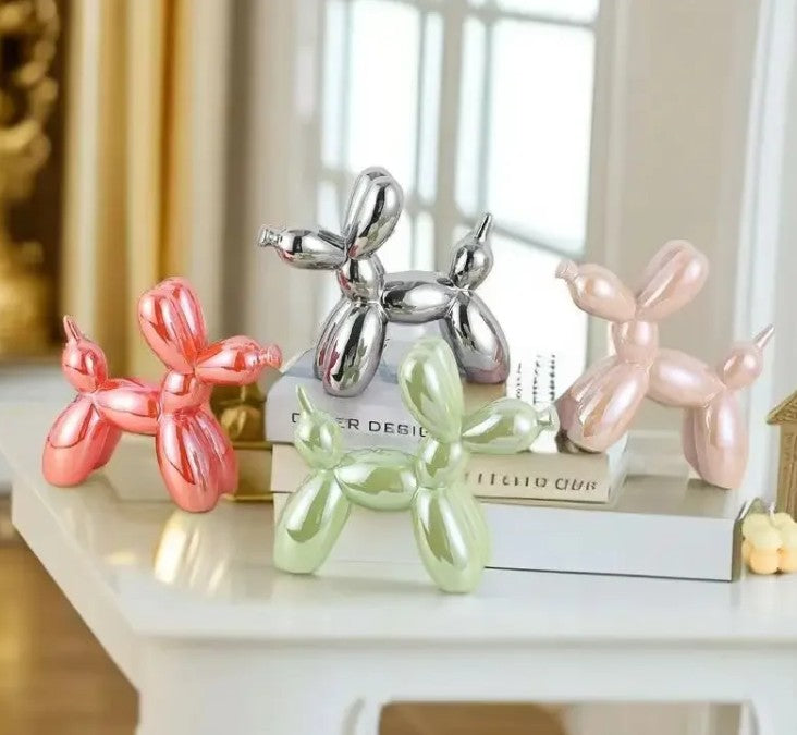 Modern home decor setup with balloon dog sculpture on desk