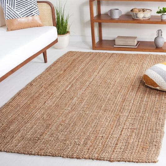 Farmhouse living room styled with a natural jute rug beneath a wooden sofa set